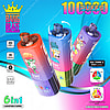 Promotional Image Featuring Three Colorful Bang Blaze 100K 6In1 Vape Devices With Cartoon Monkey Graphics, Highlighting Features Like 6-In-1 Adjustable Flavors, 10,000 Puffs, 850Mah Battery, Type-C Charging, And Oil Tank Options On A Vibrant Blue And Pink Background.