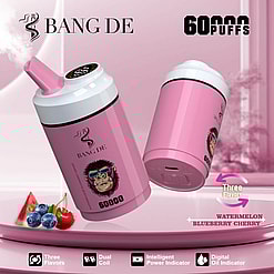 Pink Vaping Devices Labeled Bang De With A Caricature Of A Gorilla Wearing Sunglasses, Promoting Features Like Three Flavors (Watermelon, Blueberry, Cherry), Dual Coil, Intelligent Power Indicator, And 60,000 Puffs Capacity.