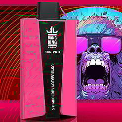 A Close-Up View Of A Bang King 30K Pro Vaping Device In Pink With A Strawberry Watermelon Flavor, Set Against A Vibrant Backdrop Featuring A Colorful Artistic Gorilla Design With Sunglasses.