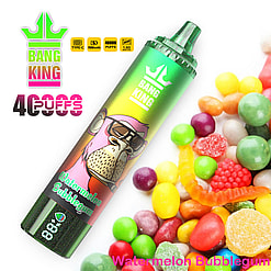 A Vibrant Vape Device Labeled 'Bang King' Featuring A Cartoon Monkey, Alongside Colorful Candies, Highlighting The Watermelon Bubblegum Flavor And 40000 Puffs Capacity.