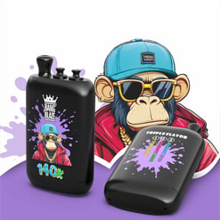 Two Black Vape Devices With Cartoon Monkey Branding, One Labeled Bang Blaze 140K And One Triple Flavor, On A Purple Background