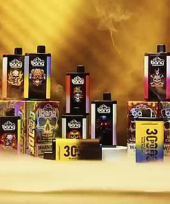 A display of colorful vaping product packaging, including disposable vape devices and boxes with vibrant designs and branding in a smoky, golden-lit setting.