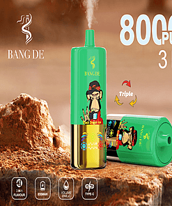 Product Advertisement For Bang De 3-In-1 Vape Device Featuring A Green Cylindrical Design With A Stylized Monkey Motif, Promoting 80000 Puffs, Three Flavors, And 650Mah Battery Capacity, Set Against A Rocky Background.