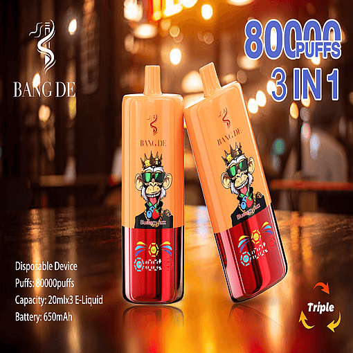 Two &Quot;Bang De&Quot; Disposable Vape Devices Featuring An Orange Design With A Cartoon Monkey Graphic, Placed On A Reflective Surface Against A Blurred Warm-Tone Background. Text On The Image Highlights Product Features Including 80,000 Puffs And Blueberry Jazz Flavor.