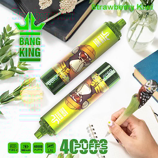 A Product Image Featuring Two Bang King Vape Devices With A Cartoon Gorilla Design, Labeled 'Strawberry Kiwi', Set Among Decorative Items Like Books And Flowers, With Product Features Like '40,000 Puffs' And 'Type-C' Specified Below.